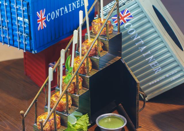 Paneer Tikka served on a miniature staircase .