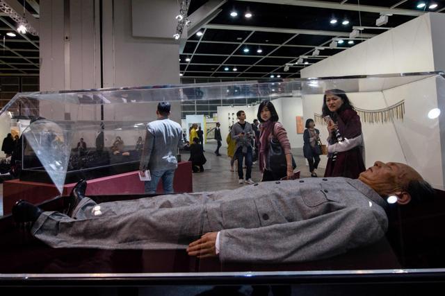 Visitors walk past Chinese artist Shen Shaomin's Mao. (AFP Photo/Anthony Wallace) Visitors walk past Chinese artist Shen Shaomin's Mao. (AFP Photo/Anthony Wallace)