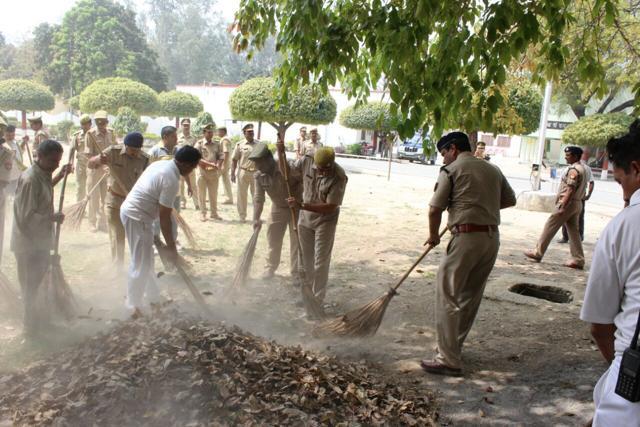 Police personnel cleaning the premises on Friday. (HT Photo) Police personnel cleaning the premises on Friday. (HT Photo)
