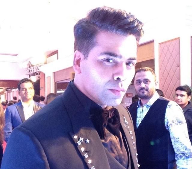 Filmmaker Karan Johar acknowledges his fans.
