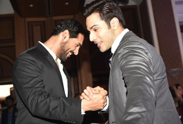 John Abraham and Varun Dhawan greet each other. (Pratik Chorge/HT Photo)