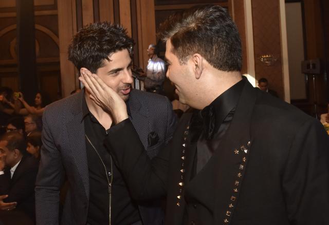 Sidhart Malhotra and Karan Johar with each other. (Pratik Chorge/HT Photo)