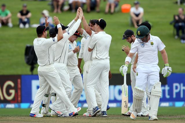 New Zealand celebrate the wicket of South Africa's Dean Elgar during day one of the third Test cricket match between New Zealand and South Africa at Seddon Park in Hamilton on Saturday. (AFP)