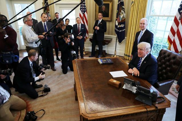 US President Donald Trump reacts to the AHCA health care bill being pulled by Congressional Republicans before a vote, in the Oval Office of the White House in Washington on Friday. (Reuters Photo)