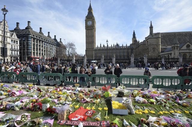 Tribute paid to the victims of the Westminster attack in Parliament Square, London. (AP Photo)
