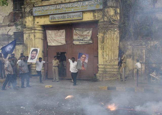 People celebrate the transfer of the 12.5-acre plot outside Indu Mill in Dadar on Saturday. (Anshuman Poyrekar/HT Photo)