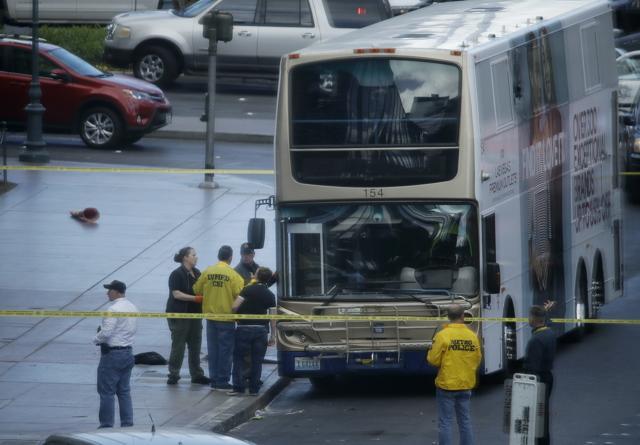 Las Vegas police investigate the scene of the stand-off in a bus along Las Vegas Boulevard. (AP Photo) Las Vegas police investigate the scene of the stand-off in a bus along Las Vegas Boulevard. (AP Photo)