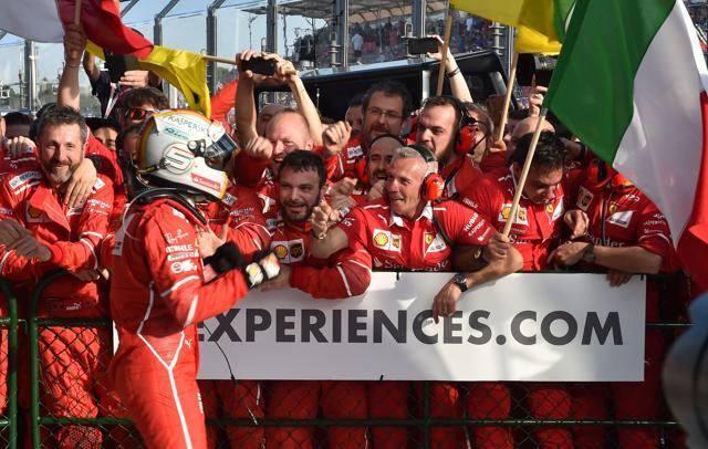 Ferrari's German driver Sebastian Vettel is congratulated by team members after he won the Formula One Australian Grand Prix in Melbourne on Sunday. (AFP) Ferrari's German driver Sebastian Vettel is congratulated by team members after he won the Formula One Australian Grand Prix in Melbourne on Sunday. (AFP)