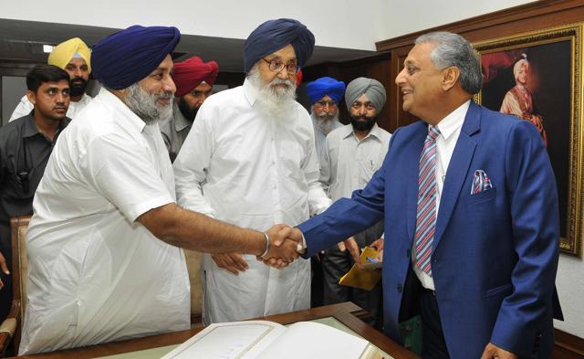SAD president Sukhbir Singh Badal shakes hands with speaker Rana KP Singh as former CM Parkash Singh Badal looks on after taking oath as MLAs at the Punjab Vidhan Sabha in Chandigarh on Monday, March 27. (Keshav Singh/HT)