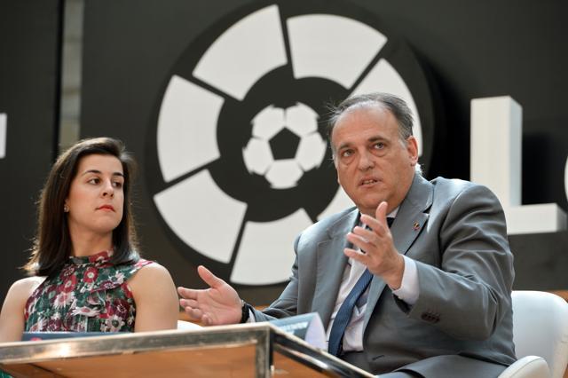 Javier Tebas, president of La Liga (R) speaks while Carolina Marin (L) La Liga ambassador listens during the official launch of Spanish Football League La Liga office in Singapore on March 23, 2017. (AFP)