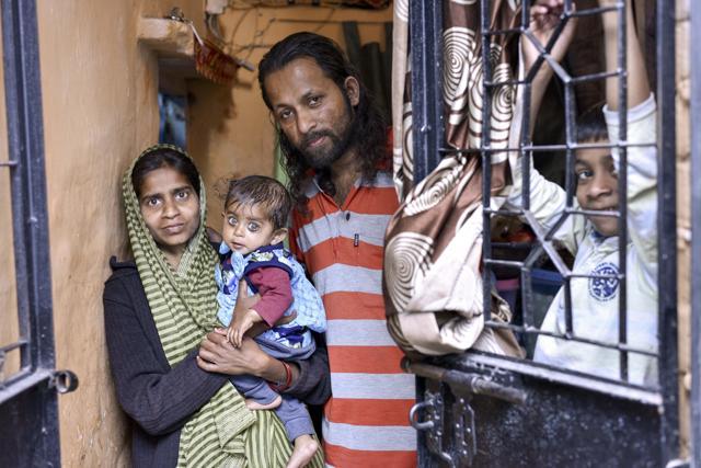 Saroj and Prem Kumar Kanojia with their daughter Mahi, who could not be enrolled for the Laadli scheme. (Arun Sharma/HT PHOTO)
