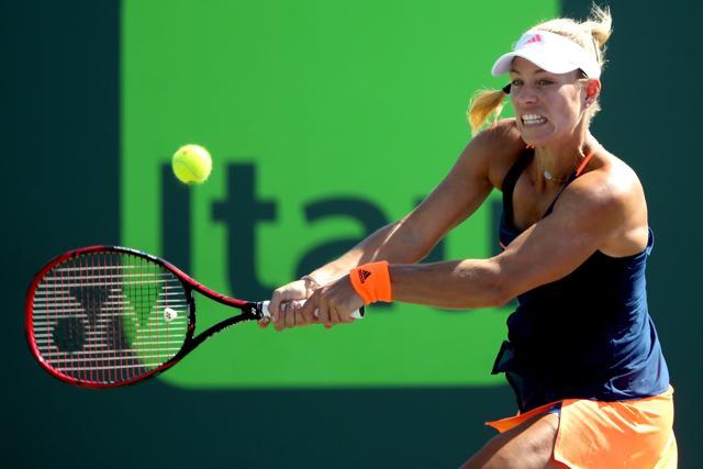 Angelique Kerber of Germany returns a shot to Risa Ozaki of Japan during the Miami Open. (AFP) Angelique Kerber of Germany returns a shot to Risa Ozaki of Japan during the Miami Open. (AFP)