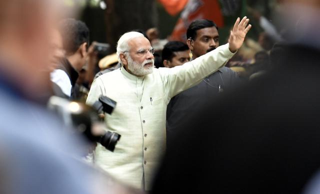 Prime Minister Narendra Modi waves to his supporters while heading towards BJP headquarters to celebrates party’s landslide victory in assembly elections in New Delhi on March 12. (Raj K Raj/HT Photo) Prime Minister Narendra Modi waves to his supporters while heading towards BJP headquarters to celebrates party’s landslide victory in assembly elections in New Delhi on March 12. (Raj K Raj/HT Photo)
