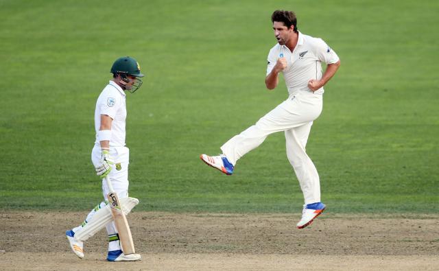 Colin de Grandhomme (R) of New Zealand celebrates the wicket of Dean Elgar of South Africa. (AFP) Colin de Grandhomme (R) of New Zealand celebrates the wicket of Dean Elgar of South Africa. (AFP)