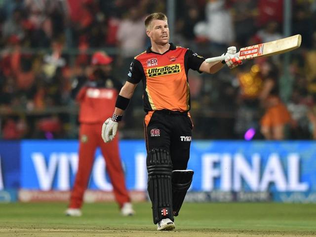 Warner raises his bat after scoring a half-century. (AFP)