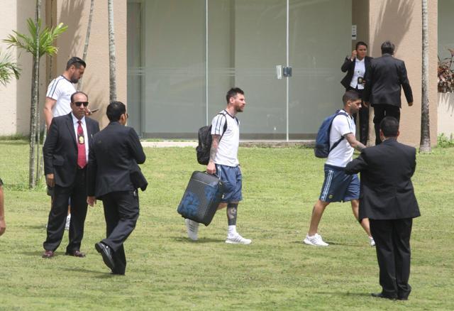 Lionel Messi heads to board a flight bound for La Paz, at the Viru Viru Airport in Santa Cruz de la Sierra, Bolivia, on Tuesday. (AFP)