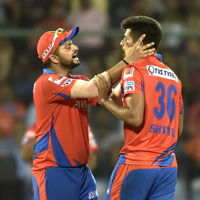 Gujarat Lions player Shivil Kaushik congratulated by Captain Suresh Raina after the dismissal of Sunrisers Hyderabad player Ben Cutting. (Ajay aggarwal/HT Photo) 