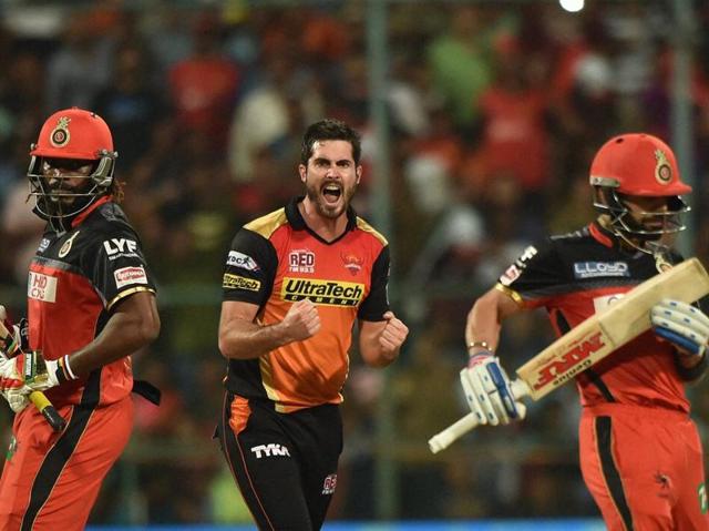 Ben Cutting (C) celebrates the wicket of Chris Gayle. (PTI)
