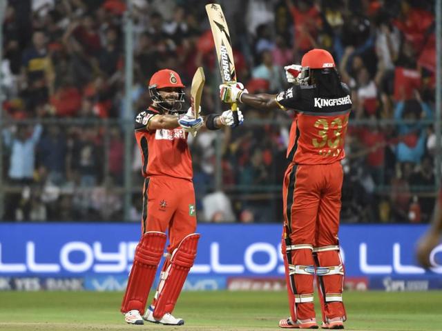 “Champion Champion”: RCB captain Virat Kohli celebrates his half century with Chris Gayle against Kings XI Punjab at M Chinnaswamy Stadium, Bengaluru on May 18, 2016. (Ravi Choudhary/ HT Photo) 