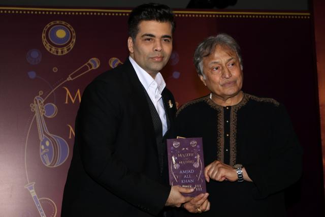 Karan Johar and sarod maestro Ustad Amjad Ali Khan during the launch of his book Master on Masters in Mumbai. (IANS)
