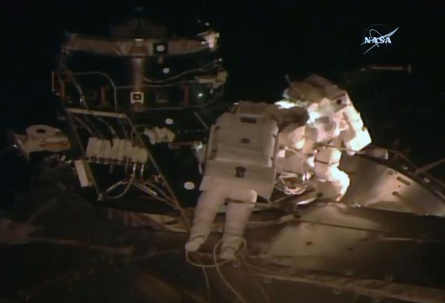 NASA TV video grab shows US astronaut Peggy Whitson (L) and Shane Kimbrough outside the International Space Staion on Thursday. (AFP Photo)