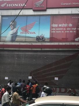 A number of customers lined up outside showrooms asking for bikes and scooters at a discounted price but, the management of showrooms had to down shutters as they had no stock left of BS-II compliant two-wheelers. (HT Photo) A number of customers lined up outside showrooms asking for bikes and scooters at a discounted price but, the management of showrooms had to down shutters as they had no stock left of BS-II compliant two-wheelers. (HT Photo)