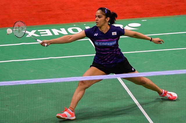 Sania Nehwal of India returns a shot against PV Sindhu on Friday. She wasted a handy lead in the second game (AFP) Sania Nehwal of India returns a shot against PV Sindhu on Friday. She wasted a handy lead in the second game (AFP)