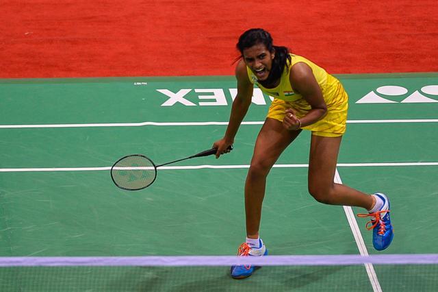 PV Sindhu celebrates a point against Sania Nehwal on Friday. (AFP) PV Sindhu celebrates a point against Sania Nehwal on Friday. (AFP)