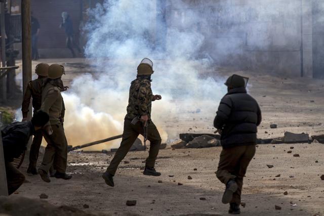 Policemen chase Kashmiri protesters during a demonstration in Srinagar. (AP File Photo) Policemen chase Kashmiri protesters during a demonstration in Srinagar. (AP File Photo)