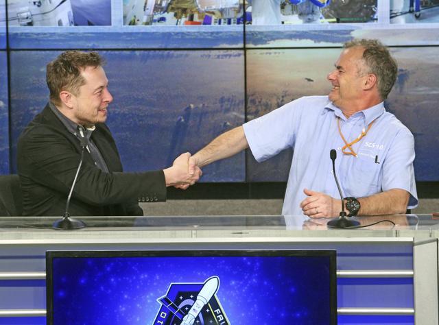 SpaceX CEO Elon Musk shakes the hand of CTO Martin Halliwell at Kennedy Space Center in Cape Canaveral. (AP Photo) SpaceX CEO Elon Musk shakes the hand of CTO Martin Halliwell at Kennedy Space Center in Cape Canaveral. (AP Photo)