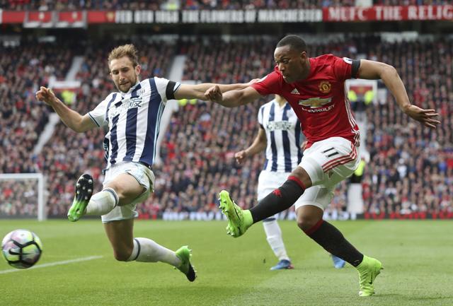 West Bromwich Albion's Craig Dawson, left, tries to block Manchester United's Anthony Martial. (AP) West Bromwich Albion's Craig Dawson, left, tries to block Manchester United's Anthony Martial. (AP)