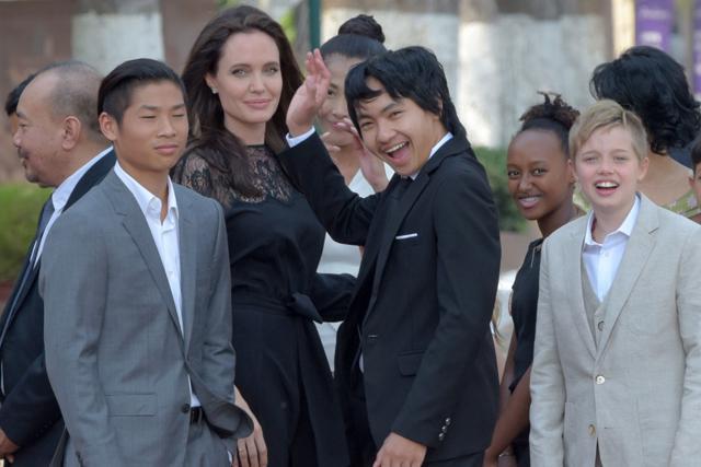 This file photo taken on February 17, 2017 shows Hollywood star Angelina Jolie (3rd L) and her children including Maddox Jolie-Pitt (C)as they gesture to media in front of the royal residence for a meeting with Cambodian King Norodom Sihamoni in Siem Reap.(AFP) This file photo taken on February 17, 2017 shows Hollywood star Angelina Jolie (3rd L) and her children including Maddox Jolie-Pitt (C)as they gesture to media in front of the royal residence for a meeting with Cambodian King Norodom Sihamoni in Siem Reap.(AFP)