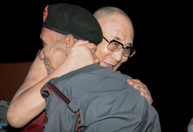 Tibetan spiritual leader the Dalai Lama embraces Naren Chandra Das, a retired havildar of the Assam Rifles, at the Namami Brahmaputra festival in Guwahati on Sunday. (PTI) Tibetan spiritual leader the Dalai Lama embraces Naren Chandra Das, a retired havildar of the Assam Rifles, at the Namami Brahmaputra festival in Guwahati on Sunday. (PTI)