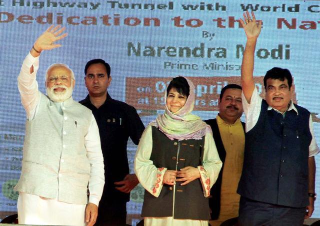 Prime Minister Narendra Modi (L), Jammu and Kashmir chief minister Mehbooba Mufti (C) and Union transport minister Nitin Gadkari at a public rally in Udhampur, Jammu on Sunday. (PTI Photo) Prime Minister Narendra Modi (L), Jammu and Kashmir chief minister Mehbooba Mufti (C) and Union transport minister Nitin Gadkari at a public rally in Udhampur, Jammu on Sunday. (PTI Photo)
