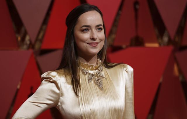 Dakota Johnson, wearing a Gucci, at the 89th Academy Awards in Hollywood, California on 2 February 2017. (REUTERS) Dakota Johnson, wearing a Gucci, at the 89th Academy Awards in Hollywood, California on 2 February 2017. (REUTERS)