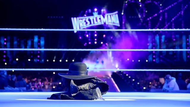 He took off his hat, coat and gloves, and placed them in the centre of the ring to announce his retirement. (wwe.com) He took off his hat, coat and gloves, and placed them in the centre of the ring to announce his retirement. (wwe.com)