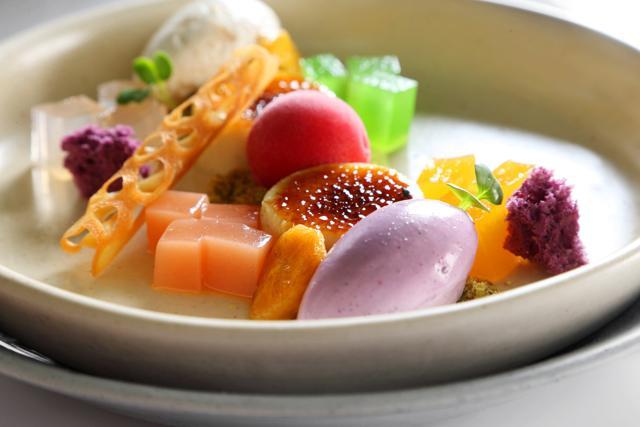 The dessert Halo Halo at The Fatty Bao is whipped using jello, caramelised bananas, purple yam ice cream, raspberry sorbet, vanilla flan and coconut granite. (HT Photo) The dessert Halo Halo at The Fatty Bao is whipped using jello, caramelised bananas, purple yam ice cream, raspberry sorbet, vanilla flan and coconut granite. (HT Photo)