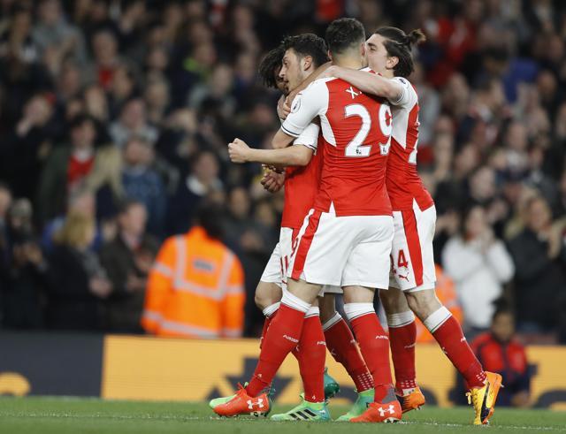 Mesut Ozil was in sparkling form as he helped Arsenal F.C. secure a 3-0 win over West Ham United to move above Manchester United F.C. in the Premier League. (AP)