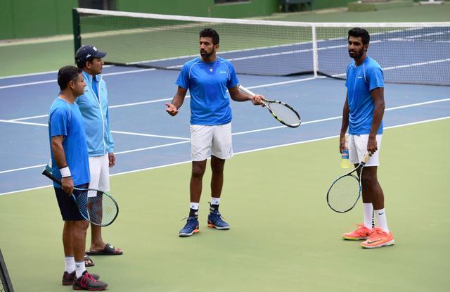 Rohan Bopanna and Prajnesh Gunneswaran with Mahesh Bhupathi and coach Zeeshan Ali during a practice session ahead of the Davis Cup tie against Uzbekistan. (PTI) Rohan Bopanna and Prajnesh Gunneswaran with Mahesh Bhupathi and coach Zeeshan Ali during a practice session ahead of the Davis Cup tie against Uzbekistan. (PTI)