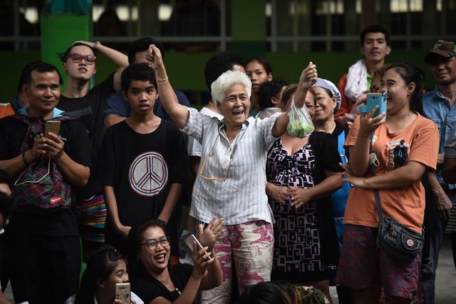 Relatives cheer after a potential draftee is exempted from military service during the annual military draft in Bangkok on April 5. (AFP) Relatives cheer after a potential draftee is exempted from military service during the annual military draft in Bangkok on April 5. (AFP)