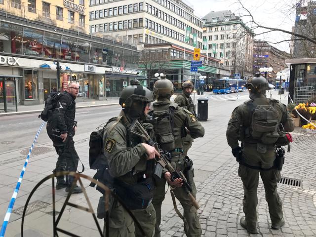 Sweden's police officers guard in the central Stockholm. (REUTERS) Sweden's police officers guard in the central Stockholm. (REUTERS)
