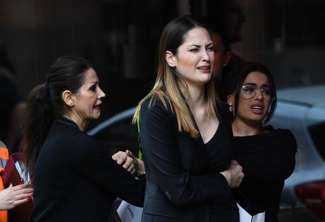 Passers react at the scene where a truck crashed into the Ahlens department store at Drottninggatan. (AFP Photo) Passers react at the scene where a truck crashed into the Ahlens department store at Drottninggatan. (AFP Photo)