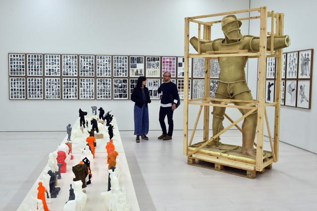 People look at an installation by Spanish artist Daniel Garcia Andujar entitled "The disasters of War" at the National museum of Contemporary Art in Athens, on Friday. (AFP) People look at an installation by Spanish artist Daniel Garcia Andujar entitled "The disasters of War" at the National museum of Contemporary Art in Athens, on Friday. (AFP)