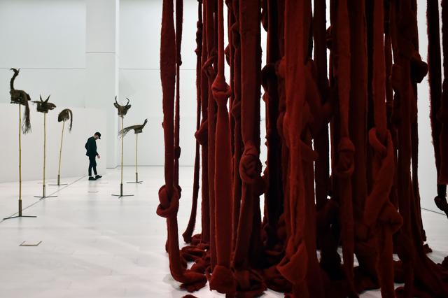 A visitor walks past an installation by Chilean artist Cecilia Vicuna, at the National museum of Contemporary Art in Athens, on Friday. (AFP) A visitor walks past an installation by Chilean artist Cecilia Vicuna, at the National museum of Contemporary Art in Athens, on Friday. (AFP)