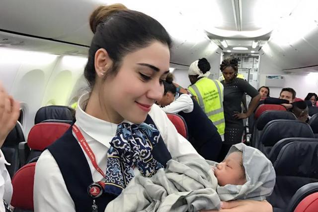 A delighted flight attendant welcomes the extra passenger. (Turkish Airlines) A delighted flight attendant welcomes the extra passenger. (Turkish Airlines)