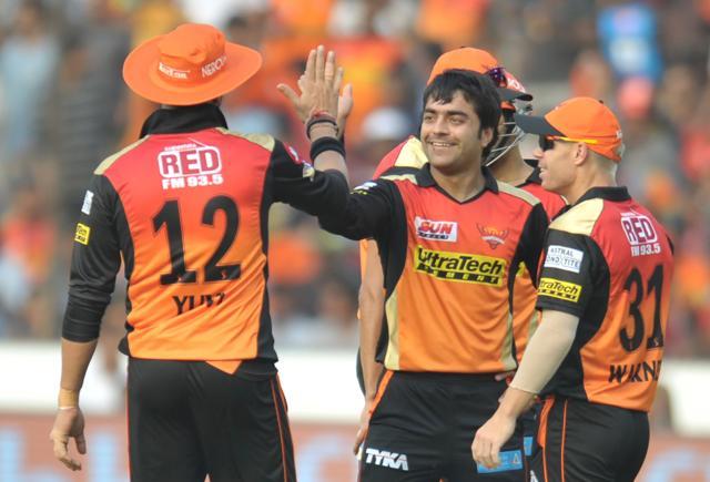 Sunrisers Hyderabad Rashid Khan (C) celebrates the wicket of Gujarat Lions captain Suresh Raina during the 2017 Indian Premier League match at the Rajiv Gandhi International Cricket Stadium in Hyderabad on April 9, 2017. (AFP)