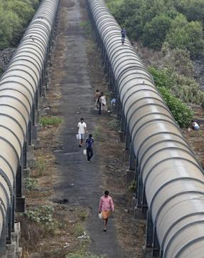 Not only are toilets a faraway dream for residents near the Dharavi Pipeline, finding a spot to go is also a long walk. The residents trek from their homes, carrying buckets of water, to the surrounding mangroves. (Vijayanand Gupta/HT Photo) Not only are toilets a faraway dream for residents near the Dharavi Pipeline, finding a spot to go is also a long walk. The residents trek from their homes, carrying buckets of water, to the surrounding mangroves. (Vijayanand Gupta/HT Photo)