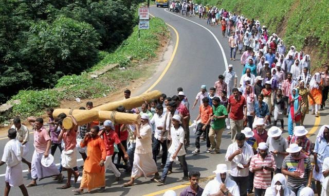Christian devotees carry a huge cross in a procession on the occasion of ‘Good Friday’ in Kozhikode. (PTI)