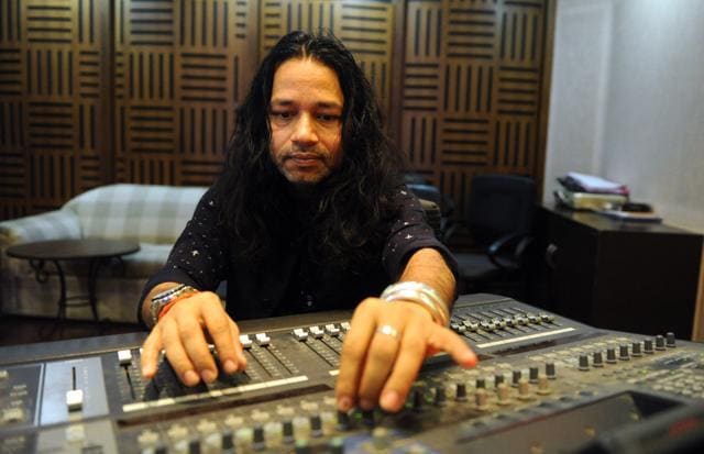 Indian Folk, Sufi and Bollywood playback singer Kailash Kher poses for photographs at his studio. (AFP)