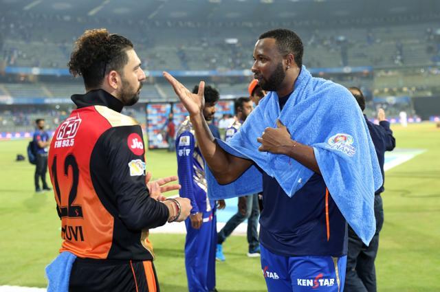 Yuvraj Singh of the Sunrisers Hyderabad and Kieron Pollard of the Mumbai Indians chat after their match at the Wankhede Stadium in Mumbai on Wednesday (BCCI)